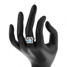 Ring aus 925 Silber, klares Zirkoniaquadrat, hellblaue Scheibe in der Mitte