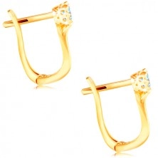 Ohrringe aus 585 Gelbgold - glitzernder blauer Zirkon in einer dekorativen Fassung